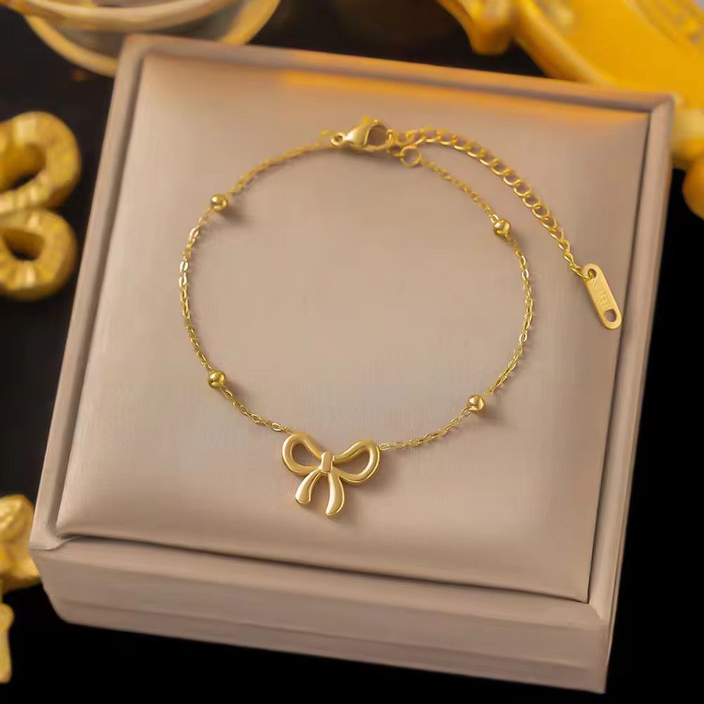 Golden Bow bracelet- Zevare.pk