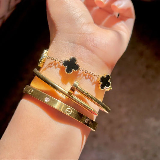 Cartier Nail, love bangle with black clover bracelet ‘Stack’ Zevare.pk